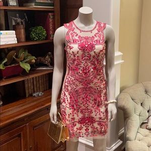 Red and cream appliqué dress with diamond closure